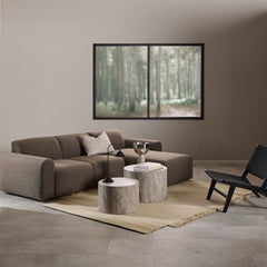Modern living room with a brown sectional sofa, wooden coffee table, and black armchair.